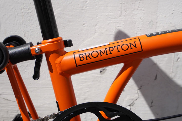 Brompton C Line Explore 6-Gang Faltrad/Klapprad mit Gepäckträger + Nabendynamo - Sunset Orange