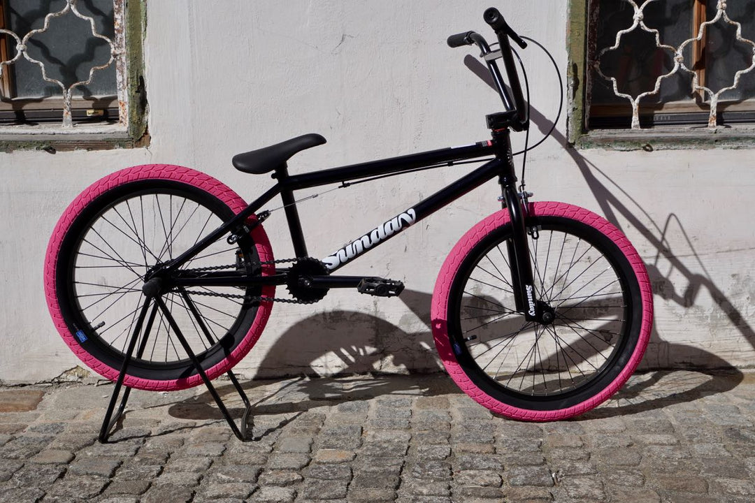 Blueprint 20" TT in gloss black with pink tires BMX